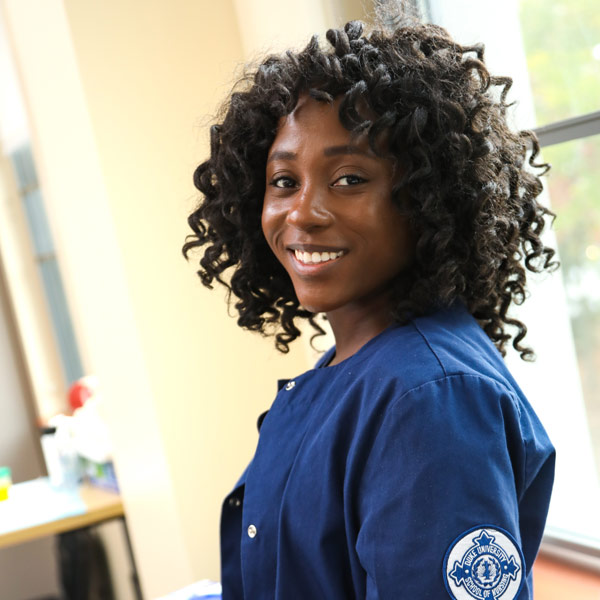 A smiling female nursing student